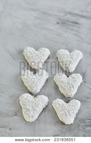 Sweet Crunchy Coconat Heart-shaped Biscuits Arranged In Pattern On Light Textured Background, Top Vi