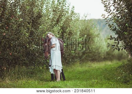 Romantic Woman Portrait With The Horse. Dreaming With Best Friend