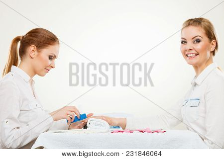 Relaxing Time And Wellness Day Concept. Blonde Elegant Woman Visiting Professional Manicurist Salon.