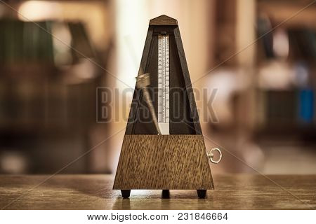 Classic metronome in a room with warm tone