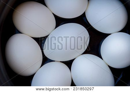 A Few Boiled Eggs In A Saucepan On Table