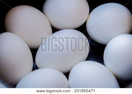 A Few Boiled Eggs In A Saucepan On Table