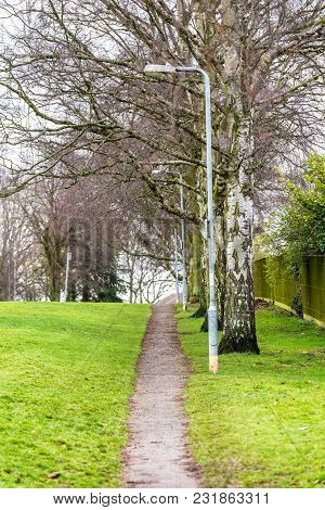 Town Park Pedestrian Footpath With Lamp Stands In Daventry Town Centre.