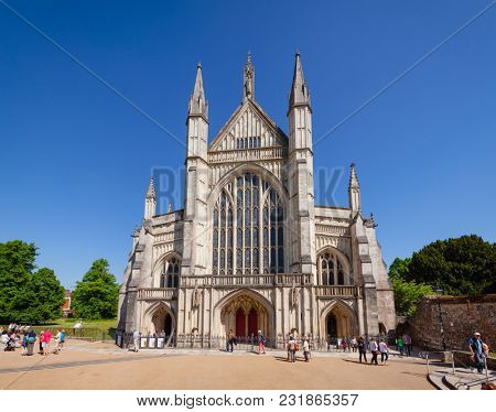 WINCHESTER, UK - JUN 8, 2013: West front of Winchester Cathedral, one of the largest cathedrals in Europe