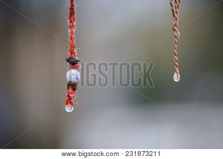 Martenitsa With Smile And Water Drop Under The Rain .