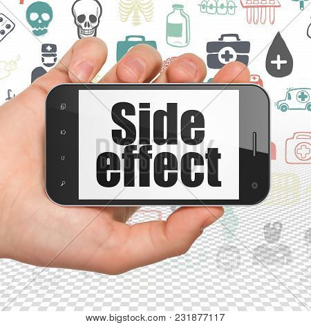 Healthcare Concept: Hand Holding Smartphone With  Black Text Side Effect On Display,  Hand Drawn Med