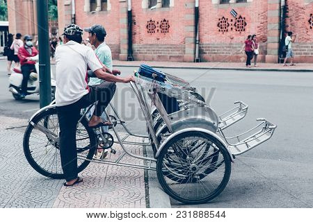 Ho Chi Minh City, Viet Nam- Nov 04: Asian Man Relax On Pedicab At Bus Saigon Station, Vietnamese Mal
