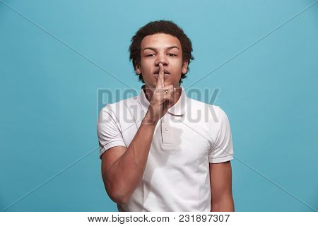 Secret, Gossip Concept. Young Man Whispering A Secret Behind His Hand. Businessman Isolated On Trend