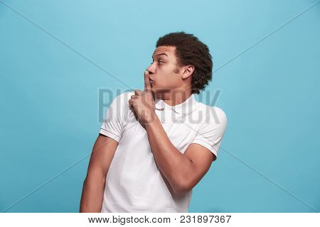 Secret, Gossip Concept. Young Man Whispering A Secret Behind His Hand. Businessman Isolated On Trend