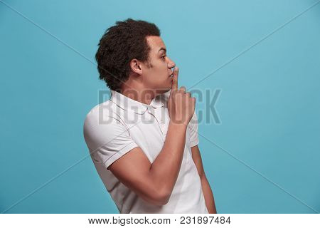 Secret, Gossip Concept. Young Man Whispering A Secret Behind His Hand. Businessman Isolated On Trend