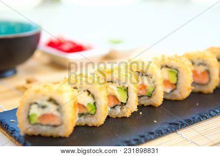 Homemade Sushi With Salmon, Omelet, Cucumber And Soft Cheese. Rustic Style.