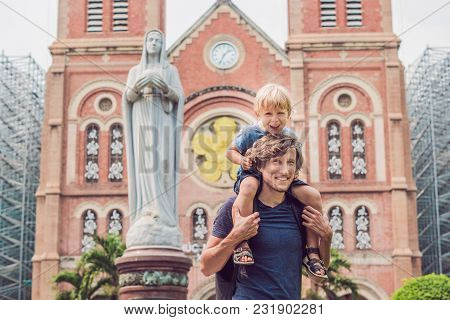 Father And Son In The Background Notre Dame De Saigon Cathedral, Build In 1883 In Ho Chi Minh City, 