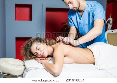 Beautiful Young Woman Relaxing With Hand Massage At Beauty Spa