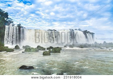 Tourists At Iguassu Falls At Iguassu National Park, World Natural Heritage Site By Unesco