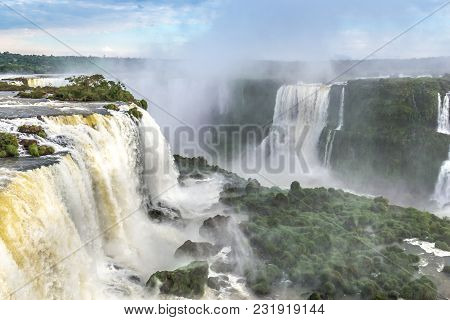 Tourists At Iguassu Falls At Iguassu National Park, World Natural Heritage Site By Unesco