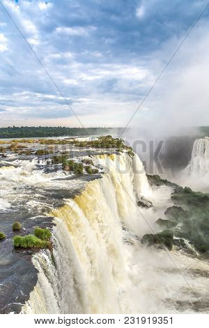 Tourists At Iguassu Falls At Iguassu National Park, World Natural Heritage Site By Unesco