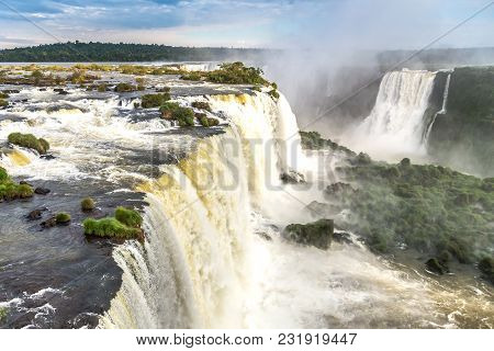 Tourists At Iguassu Falls At Iguassu National Park, World Natural Heritage Site By Unesco