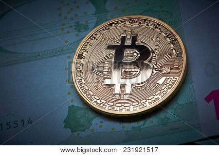 Bitcoin coins on Euro banknote as underground economy , Cryptocurrency concept photo