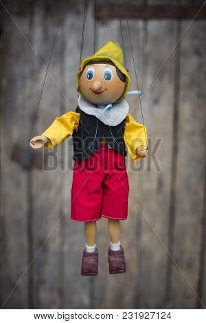 Old Wooden Pinocchio Pupett . Marionette Retro Toy.
