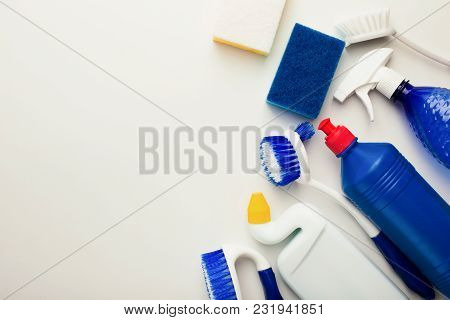 House Cleaning Products And Supplies On White Isolated Background, Top View. Spring Cleaning And Hou