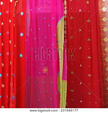 Indian traditional sari displayed in the street shop. Close up of Indian textile product.