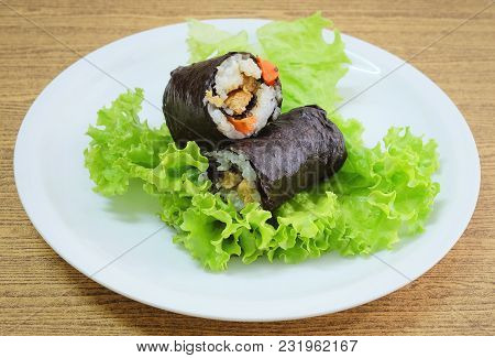 Japanese Cuisine, Traditional Vagetarian Japanese Rice Maki Sushi Roll Stuff With Tofu And Carrot Wr