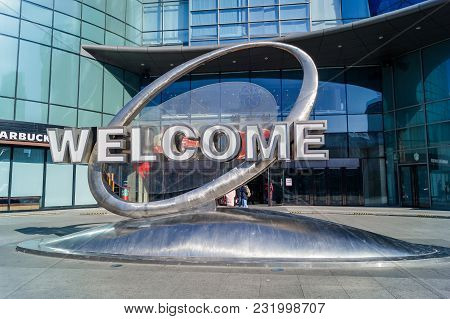Yanjixi, Jilin, China - March 9, 2018: Inscription Welcome As A Sculpture Of The Monument In Front O