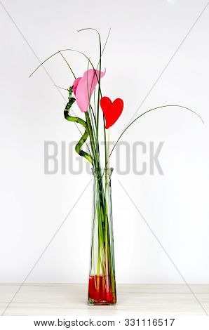 Close-up Of Artificial Flower Bouquet  With Red Heart, Green Branches Of Bambu And  Pink Colorful Ca