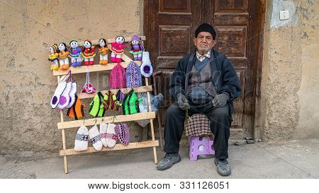 Masuleh, Iran - May 2019: Iranian Old Man Selling Hand Made Crafts For Tourists