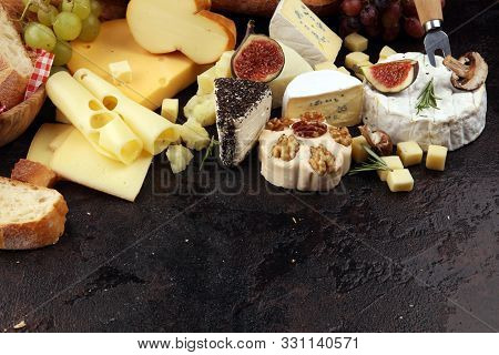 Different Sorts Of Cheese. Cheese Platter With Different Cheese And Spice