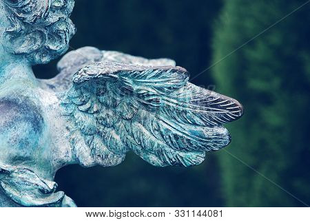 Side View Of Guardian Angel Wings At Old Cemetery