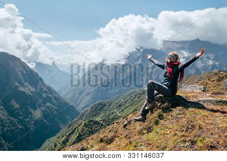 Young Hiker Backpacker Female Rising Her Arms,cheerful Laughing And Enjoying Valley During High Alti