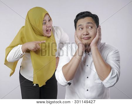 Portrait Of Muslim Couple Having Conflict, Husband Ignoring His Wife Screaming, Couple Argue