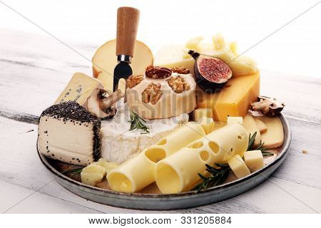 Different Sorts Of Cheese. Cheese Platter With Different Cheese And Spice