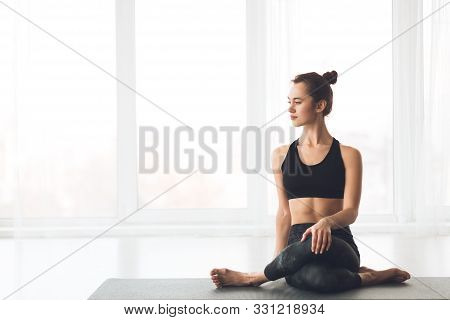 Cow Face Pose. Slim Girl Practicing Yoga, Sitting In Gomukasana Pose, Free Space