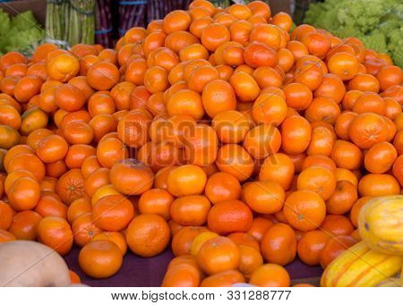 Selective Focus On Cuties Mandarins, Close-up Shot, For Sale At A Farmers Market, Together With Aspa