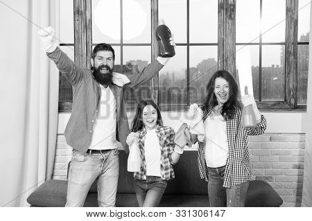 Spring Cleaning. Your One Stop For Home Cleaning Needs. Happy Family Hold Cleaning Products. Mother,