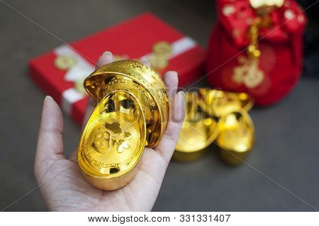 New Year Gift, Red Pouch Money Bag, Chinese Gold Coins And Gold Ingots With Chinese Character Meanin