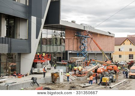 Workers Finishings At The Mall Festival Centrum Building Site