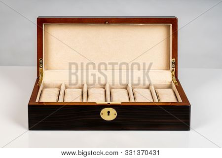 Empty Brown Wooden Luxury Jewelry Watch Case Box With Open Lid And Padded Inside On White Background