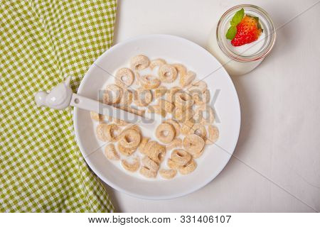 Delicious And Nutritious Cereal Loops In A Bowl With Milk For Healthy Breakfast For Kids