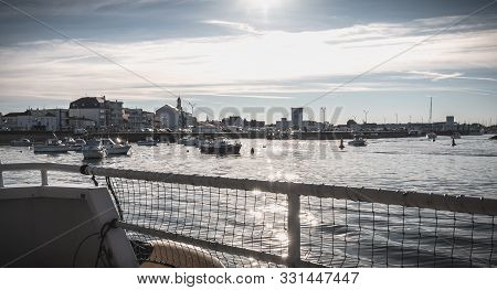 Rear View Of A Ferry Leaving The Port