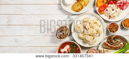 Selection Of Traditional Ukrainian Food - Borsch, Perogies, Potato Cakes, Pickled Vegetables, Top Vi