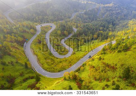 Aerial View Of Winding Road On Mountain In Autumn