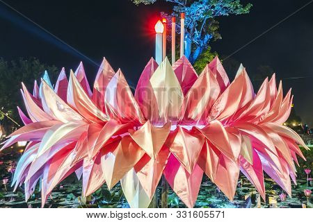 A Beautiful Large Pink Krathong Made Of Cloth Is Displayed In The Reservoir In The Event As A Symbol