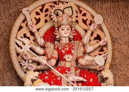 Goddess Durga Idol At Decorated Durga Puja Pandal, Shot At Colored Light, At Kolkata, West Bengal, I