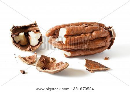 Pecan Nut - Carya Illinoinensis - Cracked Open, Shells On Table, Isolated On White Background, Detai
