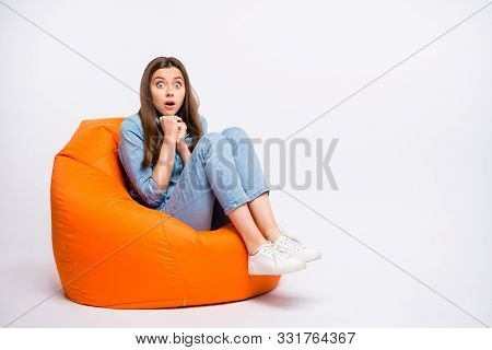 Full Size Photo Of Scared Girl Sit Big Lounge Chair Watch Horror Series Feel Nervous Have Shock Stay