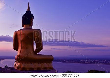 The Big Golden Buddha Statue Of Phu Salao Temple With Mekong River Flows Through The Pakse City In B