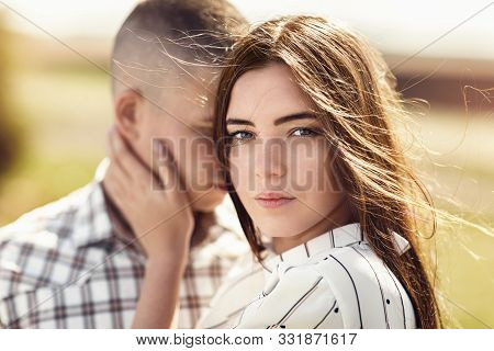 Portrait Of A Young Beautiful Girl With A Man Full Of Love. The Model Looks With A Deep Look, Close-